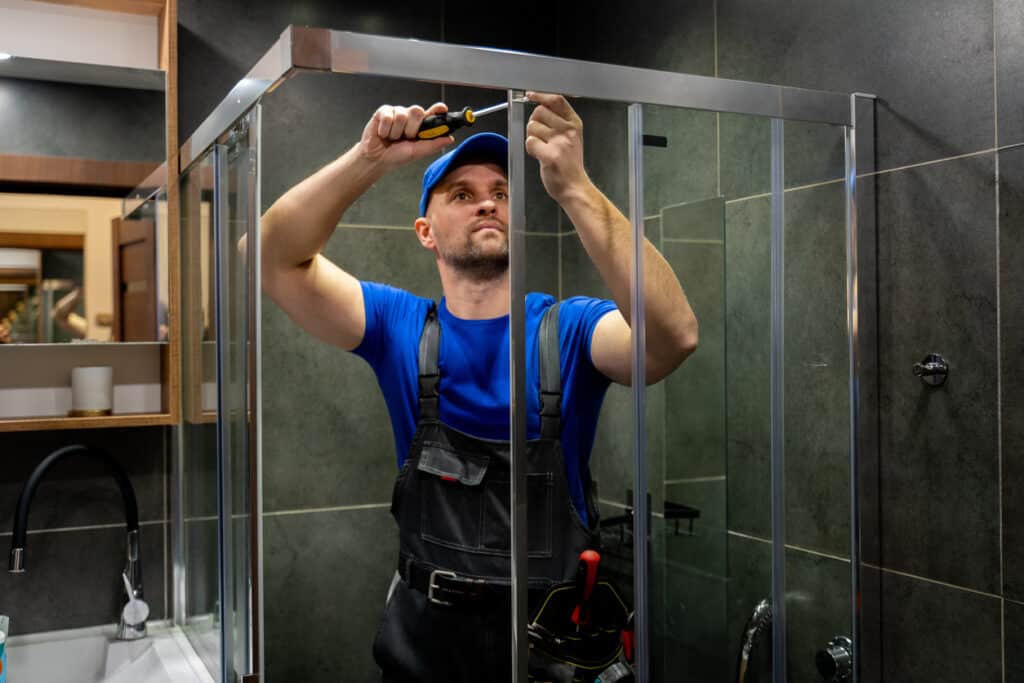 man repairs the shower