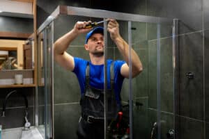 man repairs the shower